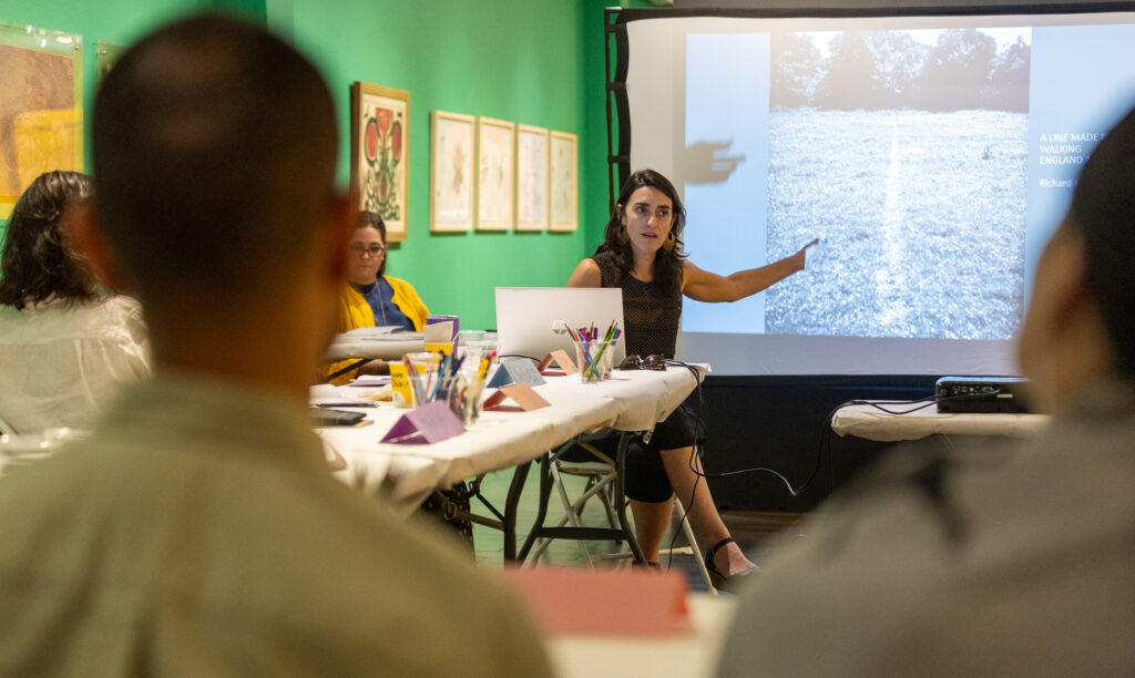 One person speaking in front of a group