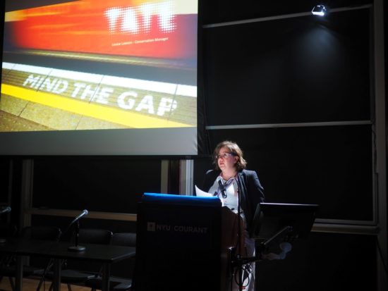 A photograph of Louise Lawson presenting a slide-show