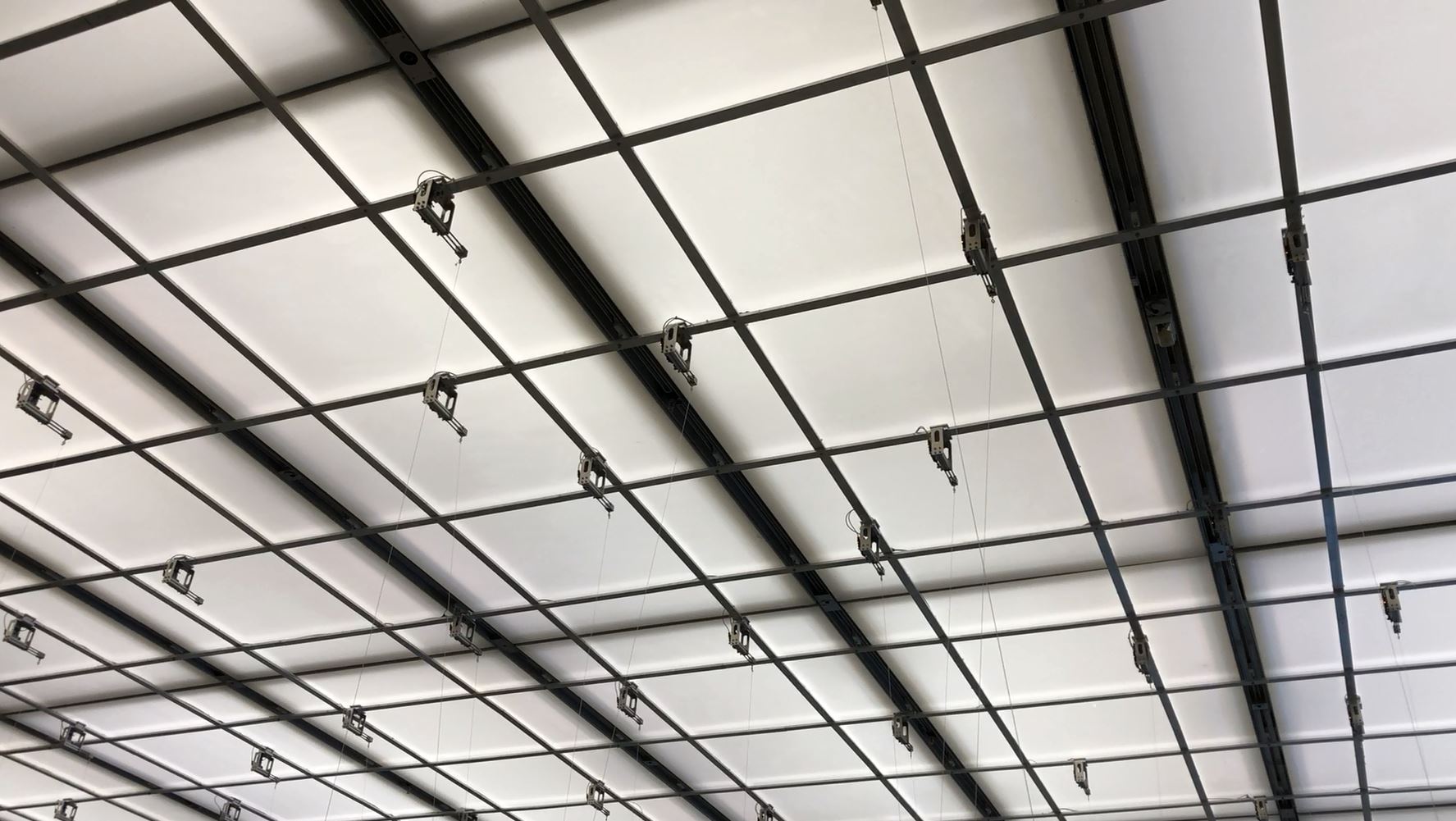 A photograph of a ceiling with compressed air cylinders