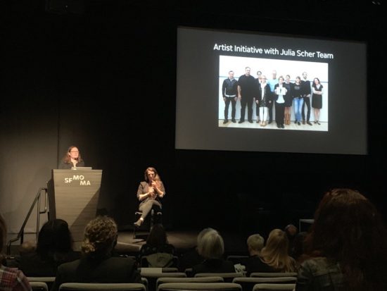 A photo of Robin Clark giving a presentation on the SFMOMA Artist Initiative