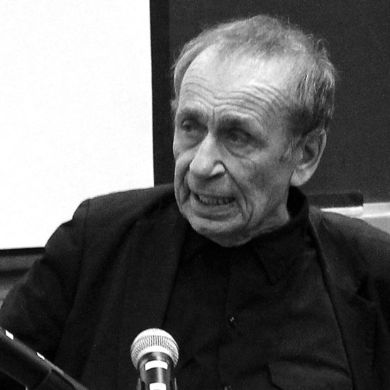 A black and white photo of Vito Acconci
