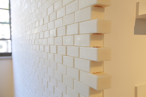 A photo of a wall made of bars of white soap