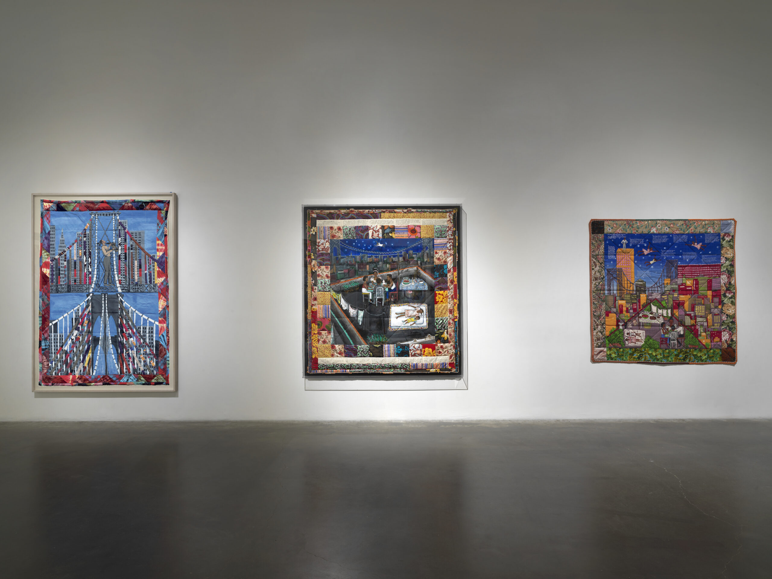 A photo of 3 Faith Ringgold story quilts installed at the New Museum, New York