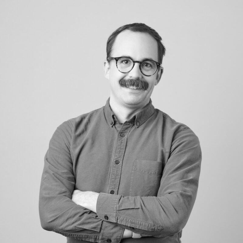 Black and white headshot photo of Peter Oleksik